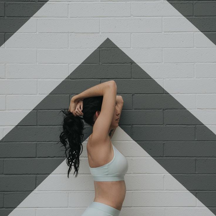 Women in a fitness class doing stretching and mobility exercises